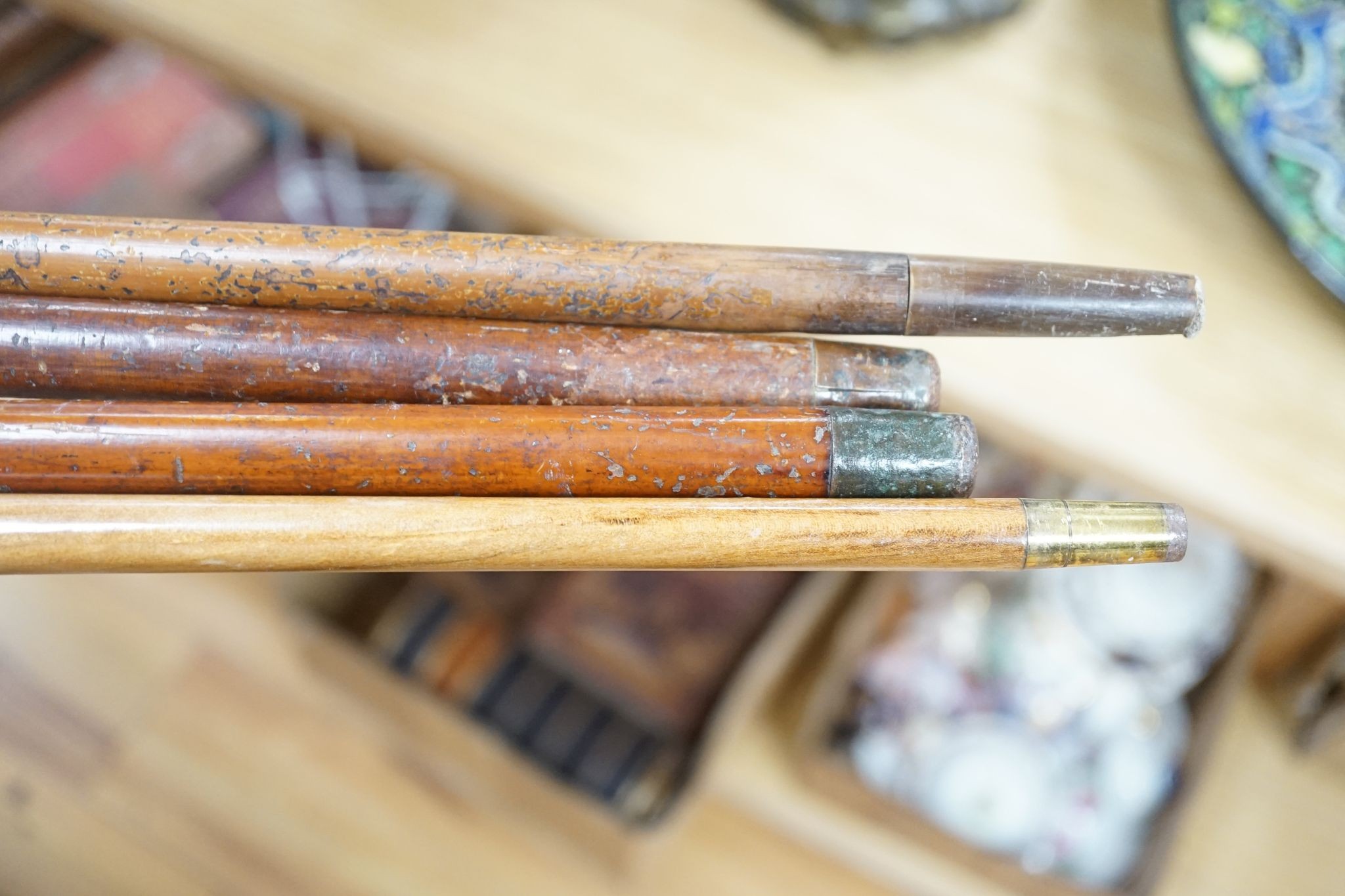 Four Victorian gilt-metal mounted walking canes, longest 97cm